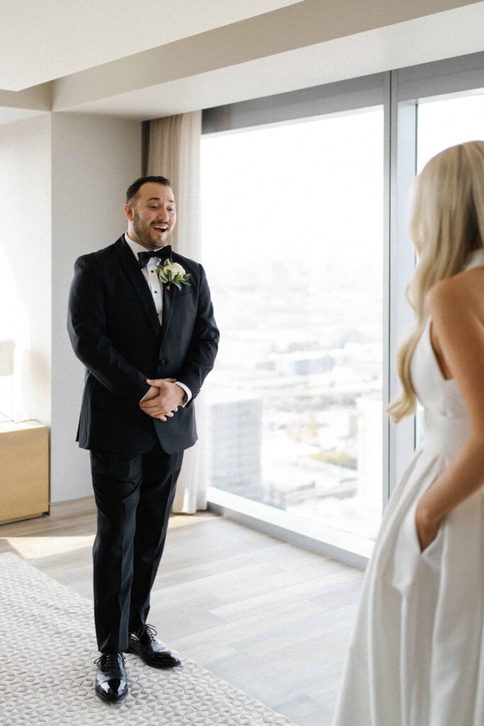 Bride and groom first look wedding photos at their Chicago hotel.