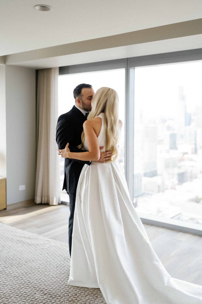 Bride and groom first look wedding photos at their Chicago hotel.