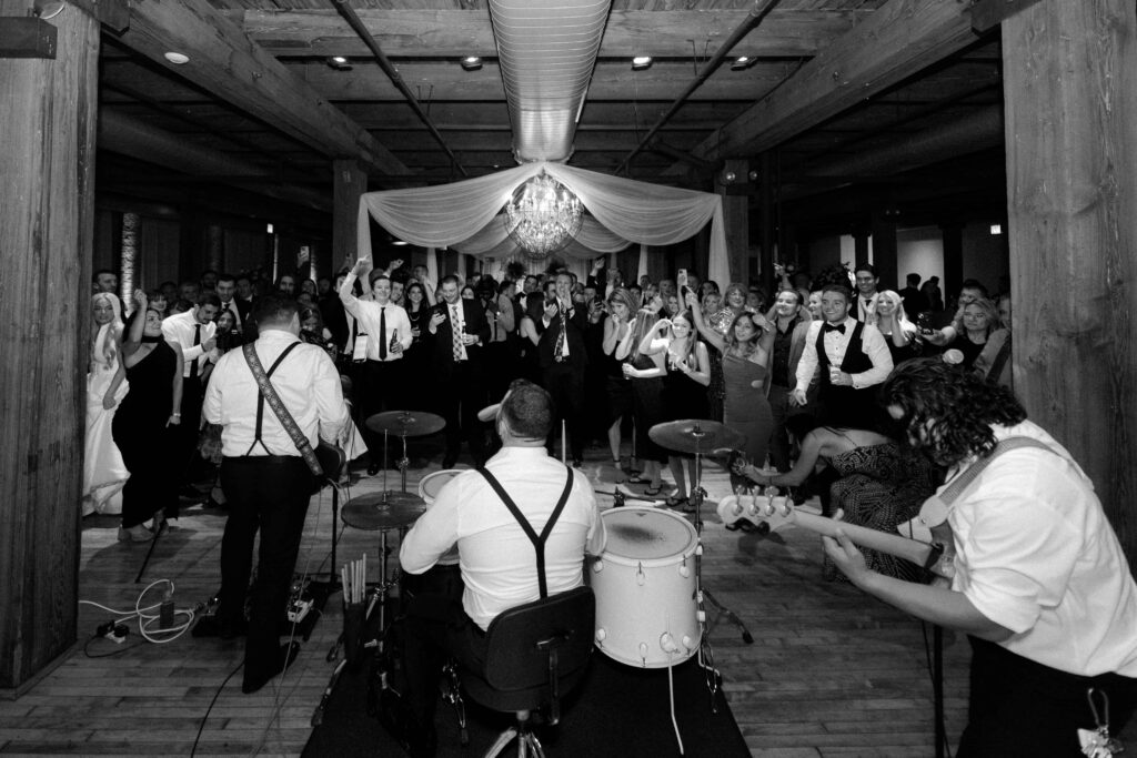 Groom playing drums in the Skyline Loft at Bridgeport Art Center.