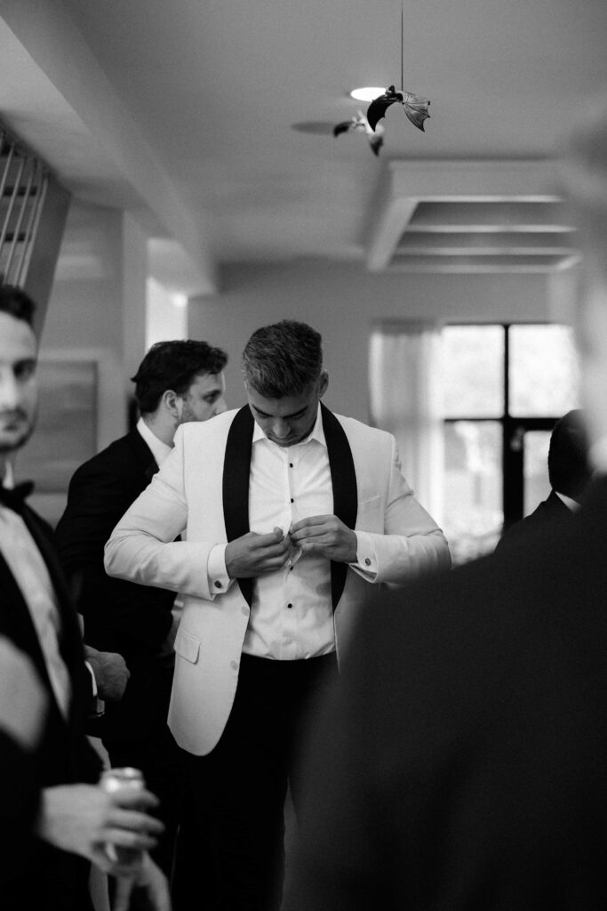 Groom getting ready before his wedding day in Chicago.