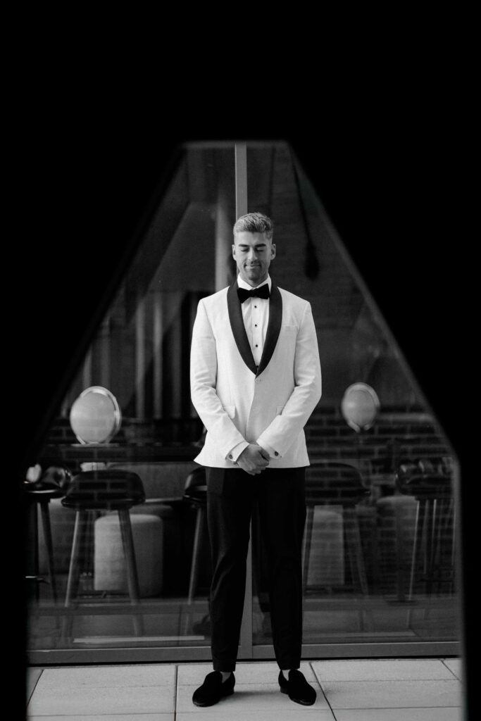 Black and white editorial groom portraits at The Robey Hotel.