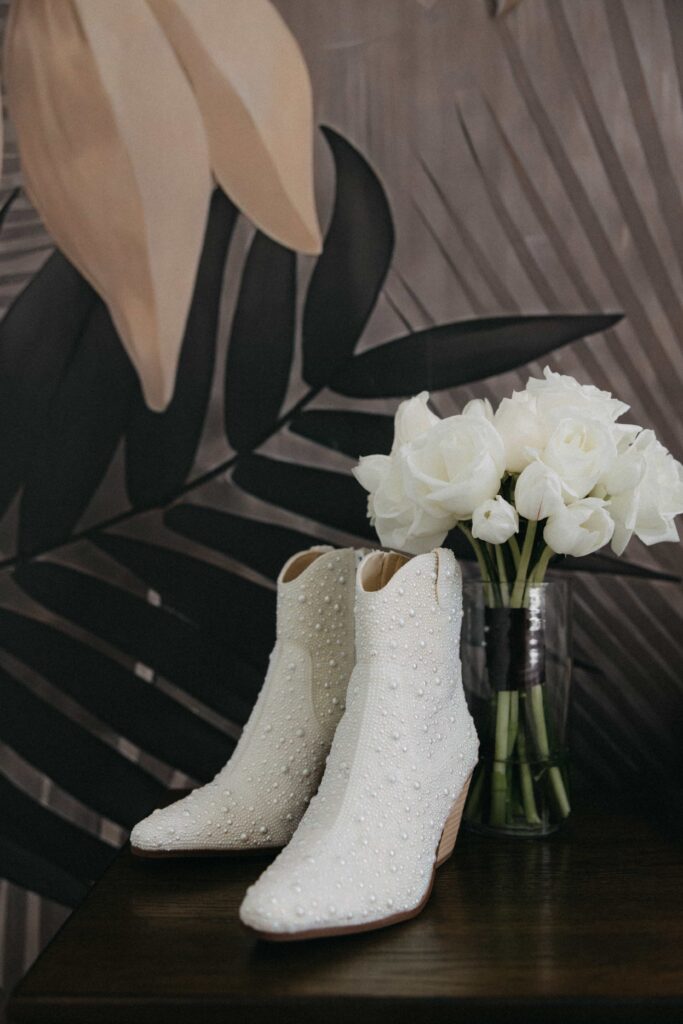 A bride's cowboy boots as she gets ready for her Chicago luxury wedding.