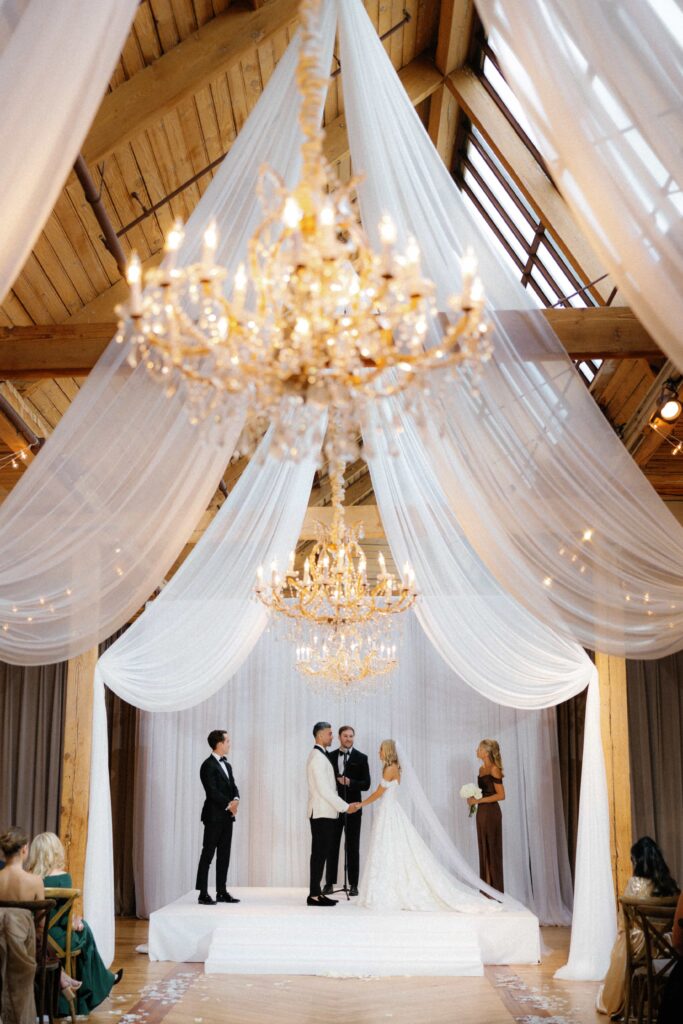 Bride and groom during their ceremony in the Skyline Loft at the Bridgeport Art Center.