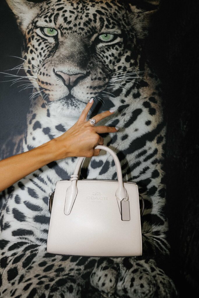 A brides wedding ring and coach bag as she gets ready for her luxury Chicago wedding.