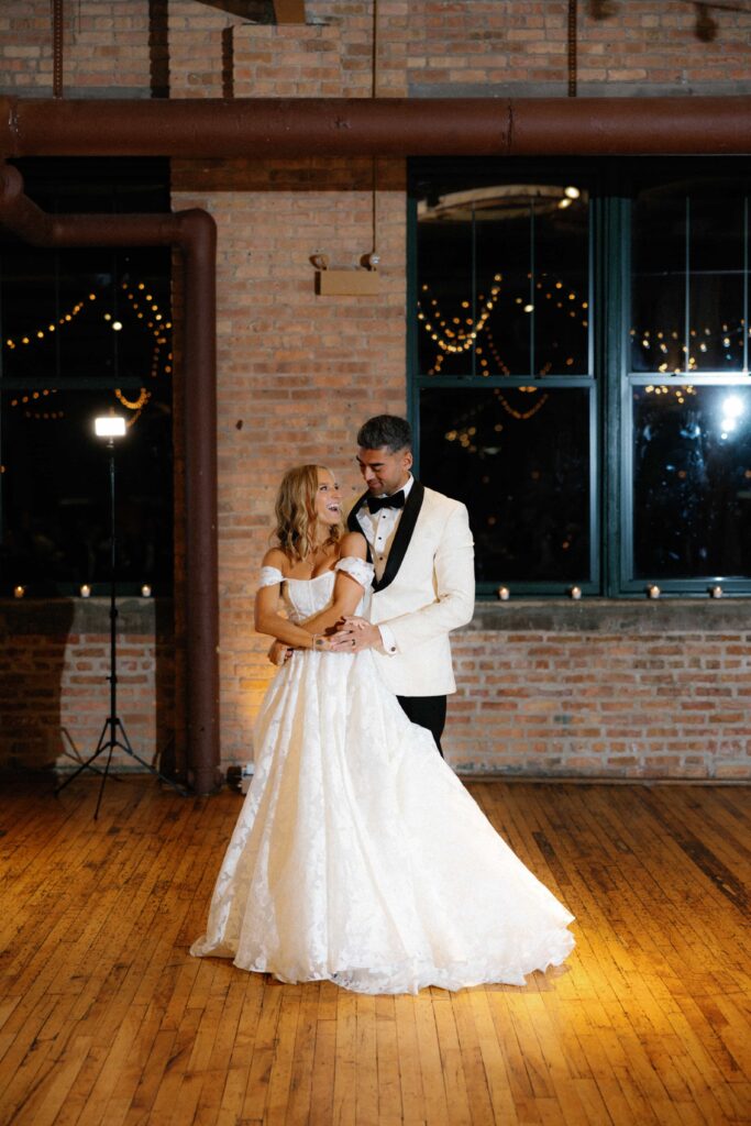 Bride and groom enjoying their first dance during their wedding reception at the Bridgeport Art Center.