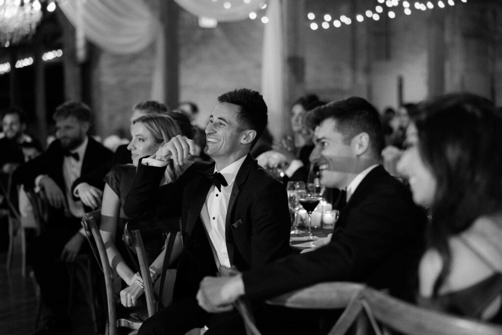 Wedding guests candid emotional moments at the Bridgeport Art Center during the reception.