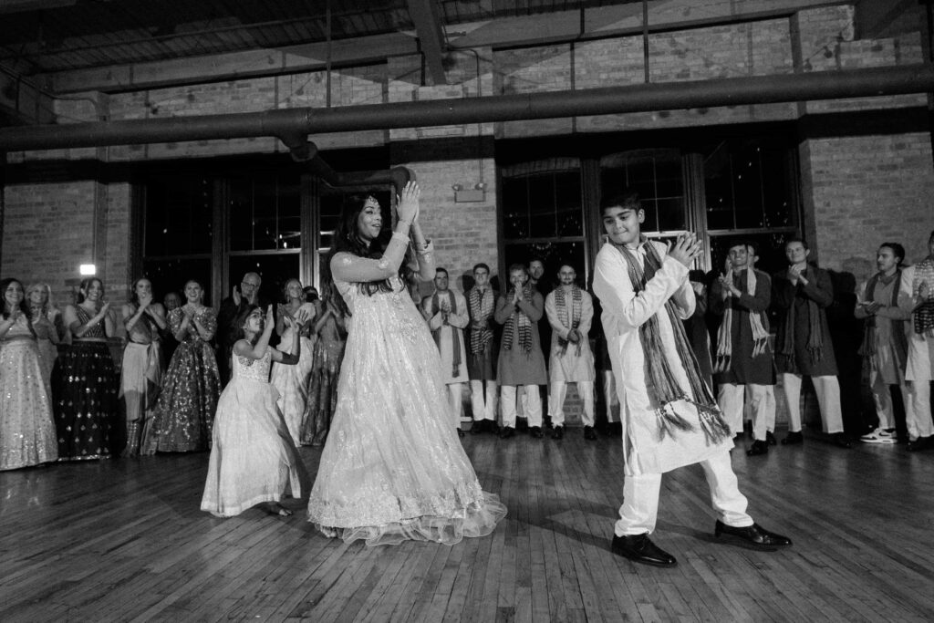 Family of the bride and groom dance during the wedding reception at the Bridgeport Art Center.