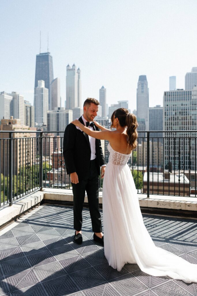 Bride and groom share a moment at the first look before their Chicago wedding.