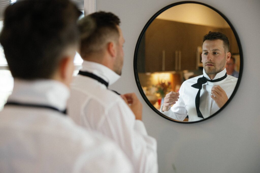 Groom getting ready at her Bridgeport Art Center wedding.