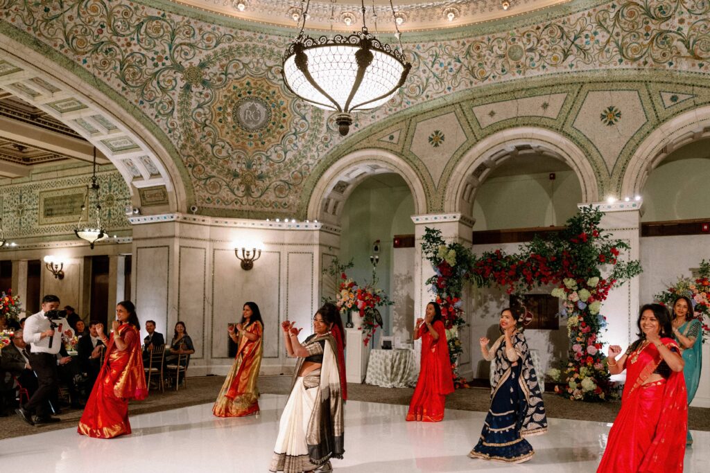 Guests dancing at the wedding reception at the Chicago Cultural Center.