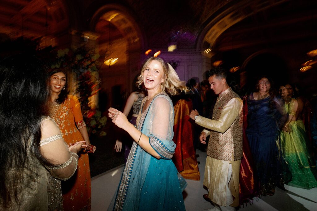 Guests dancing at the wedding reception at the Chicago Cultural Center.