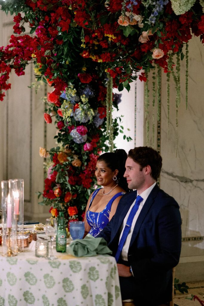 Bride and groom at the sweetheart table during their wedding reception at the Chicago Cultural Center.