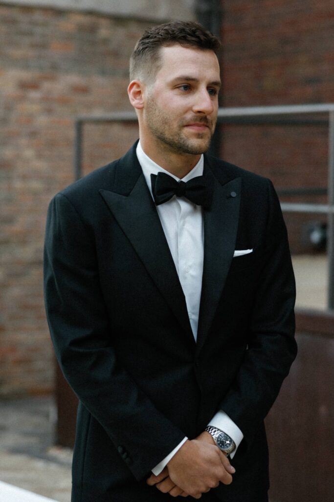 Groom looking at his bride in Bridgeport Art Center during their Chicago wedding.