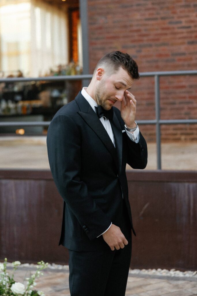 Groom getting emotional seeing his bride in Bridgeport Art Center during their Chicago wedding.