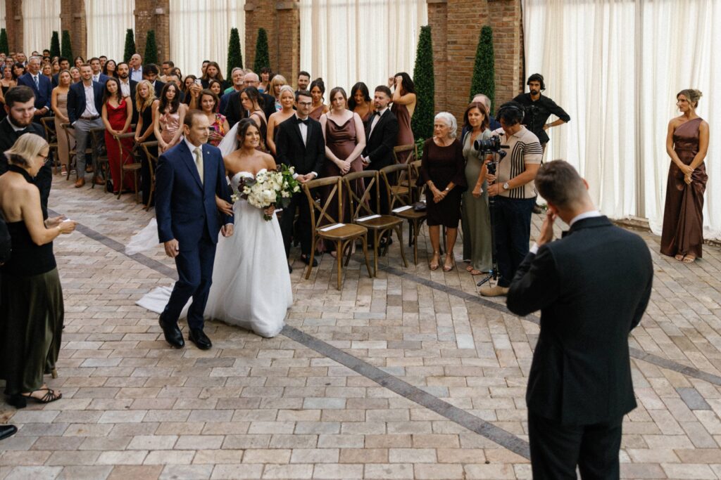 Groom getting emotional seeing his bride in Bridgeport Art Center during their Chicago wedding.