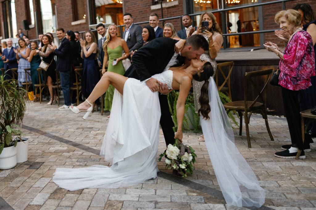 The bride and groom share a kiss at their Bridgeport Art Center Chicago wedding.