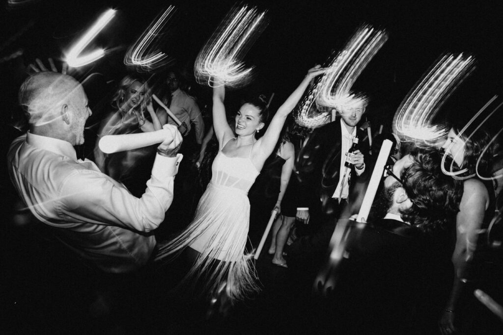 Motion blur dance floor photos in black and white at a Revel Space wedding reception.