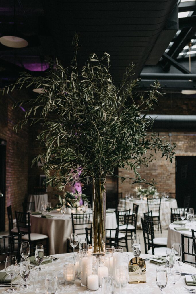 Floral centerpiece at a Revel Motor Row wedding reception.