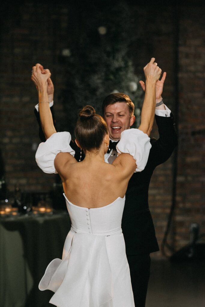 Bride and groom celebrate and dance during their Revel Space reception in Chicago.