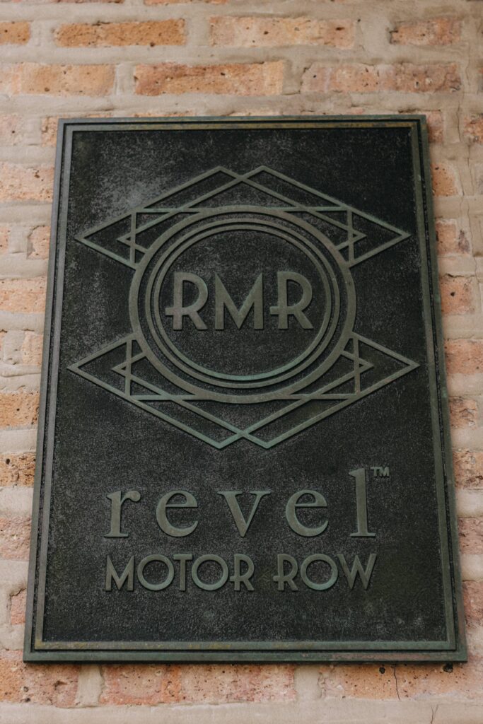 Revel Motor Row, a luxury Chicago wedding venue, and their vintage sign.