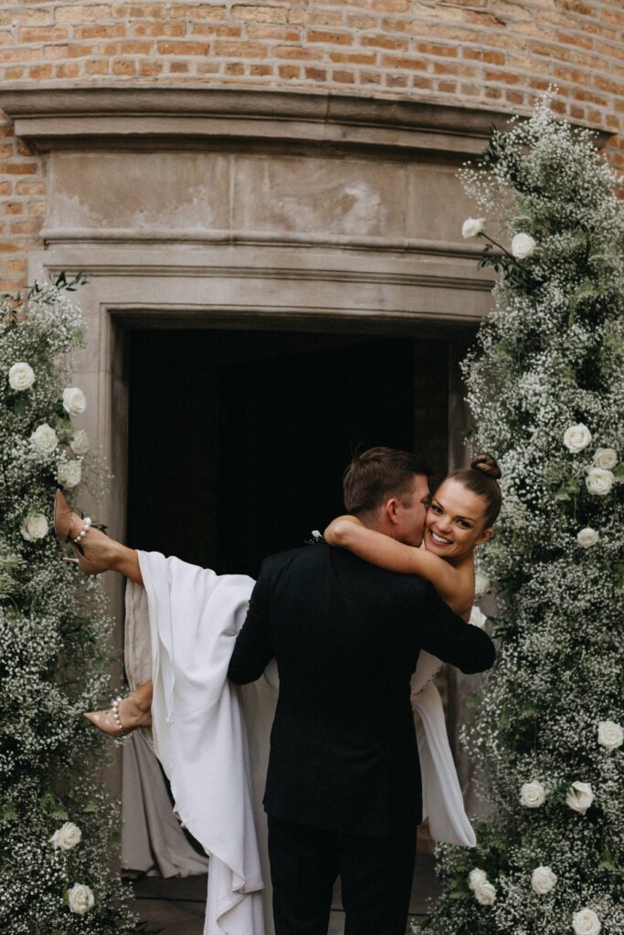 Bride and groom wedding day portraits in the courtyard of Revel Space.