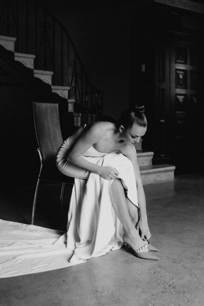 Black and white shot of the bride getting ready at Revel Space.