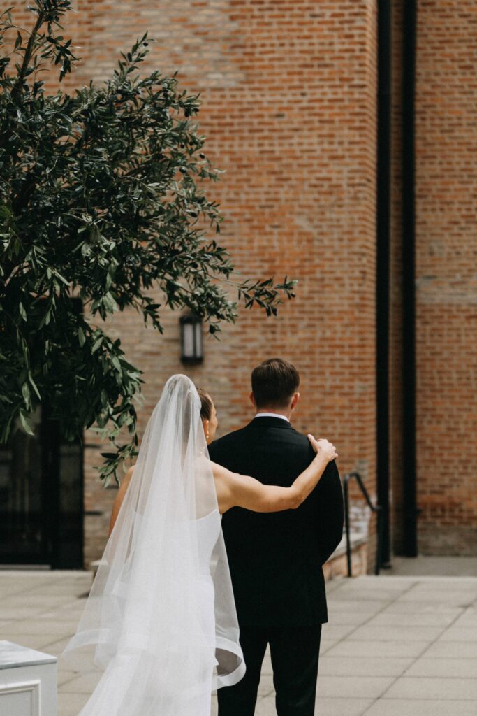 Bride and groom's first look outside Revel Space.