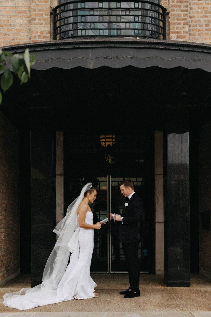 Private vow exchange in front of the entrance to Revel Space in Chicago.