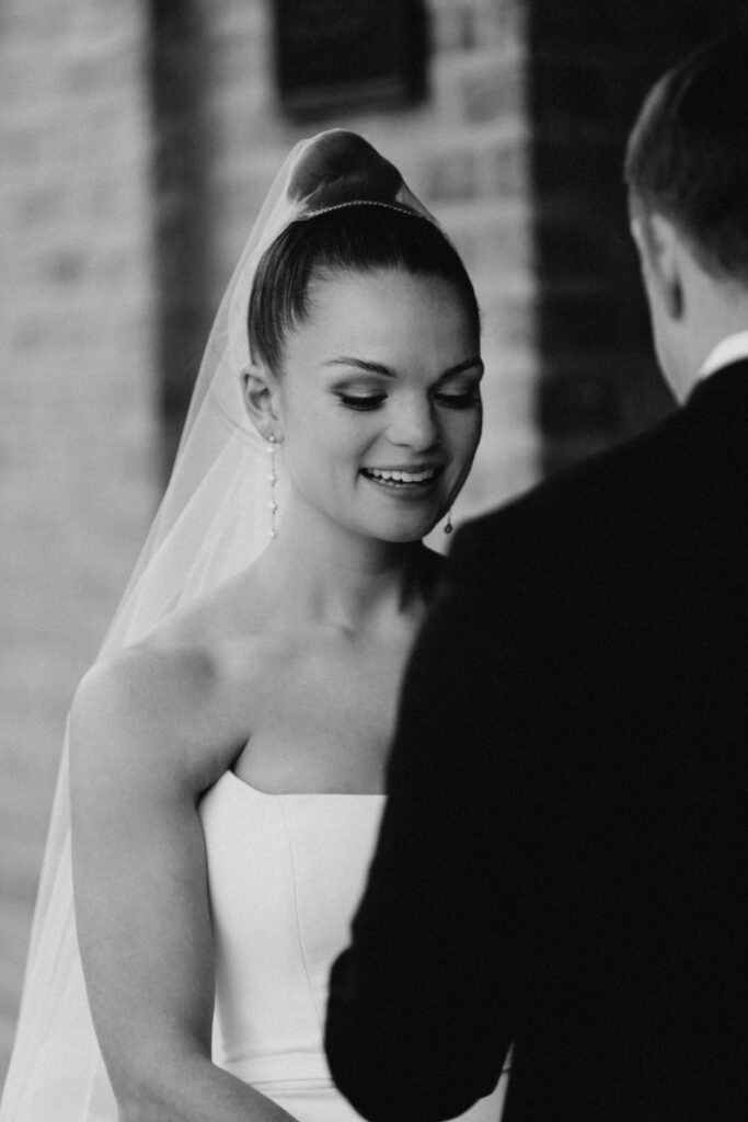 Bride shares her vows with the groom during a private exchange.