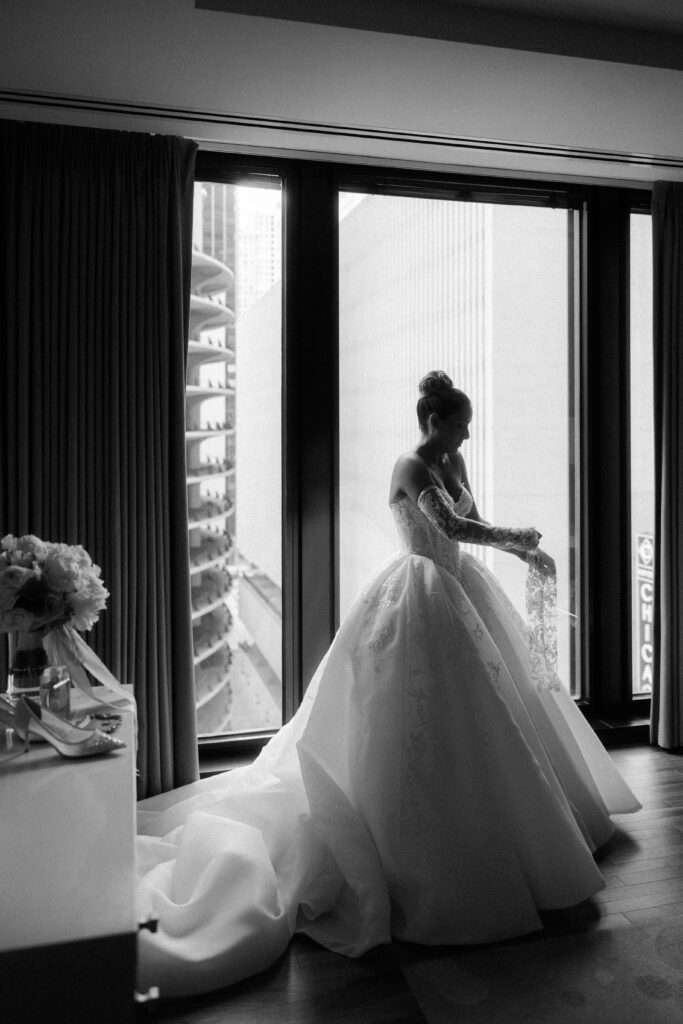 Bride puts on her bridal gloves at The Old Post Office