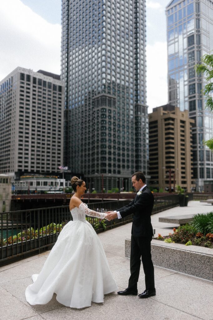 Bride and groom see each other during first look in downtown Chicago