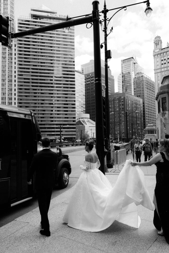 Bride and groom walk through downtown Chicago