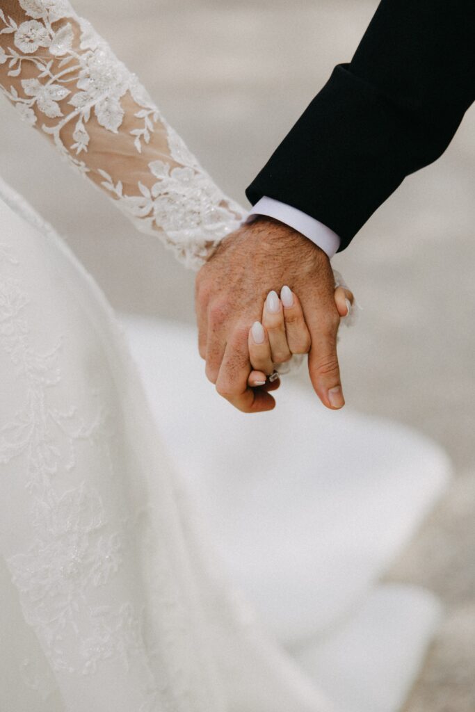 Couple holds hands
