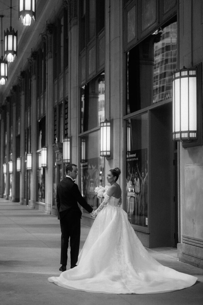 Bride and groom hold hands in downtown Chicago