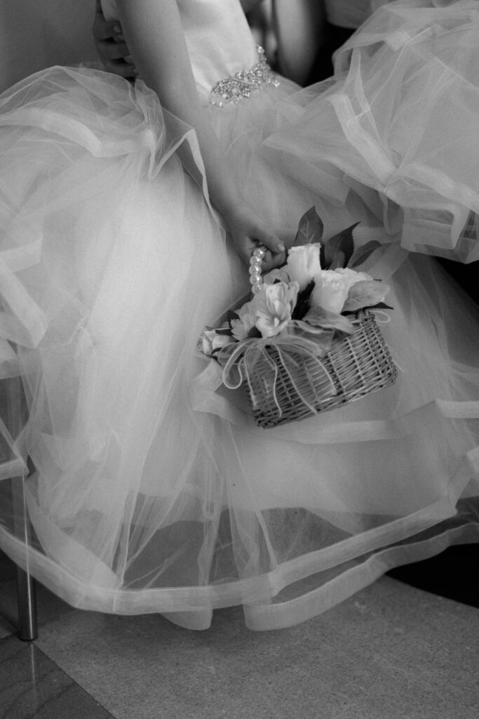 Flower girl details at wedding ceremony at The Old Post Office