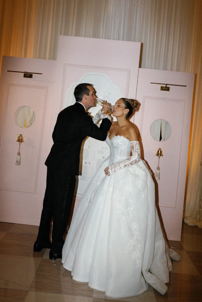 Couples drinks champagne at their Chicago wedding reception