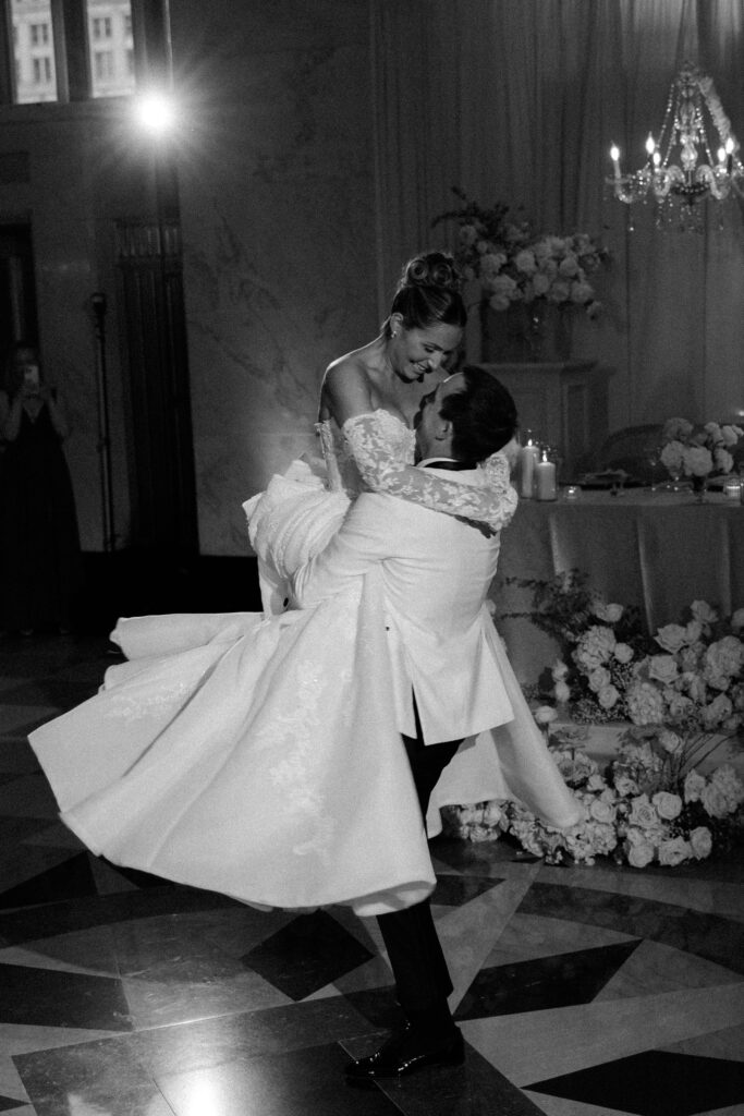 Couple twirls during their first dance at The Old Post Office in Chicago