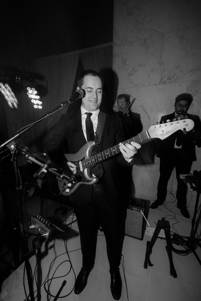 Band playing guitar at The Old Post Office